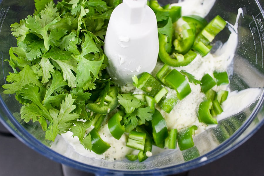 Creamy Jalapeno Cilantro Dip ingredients in the bowl of a food processor