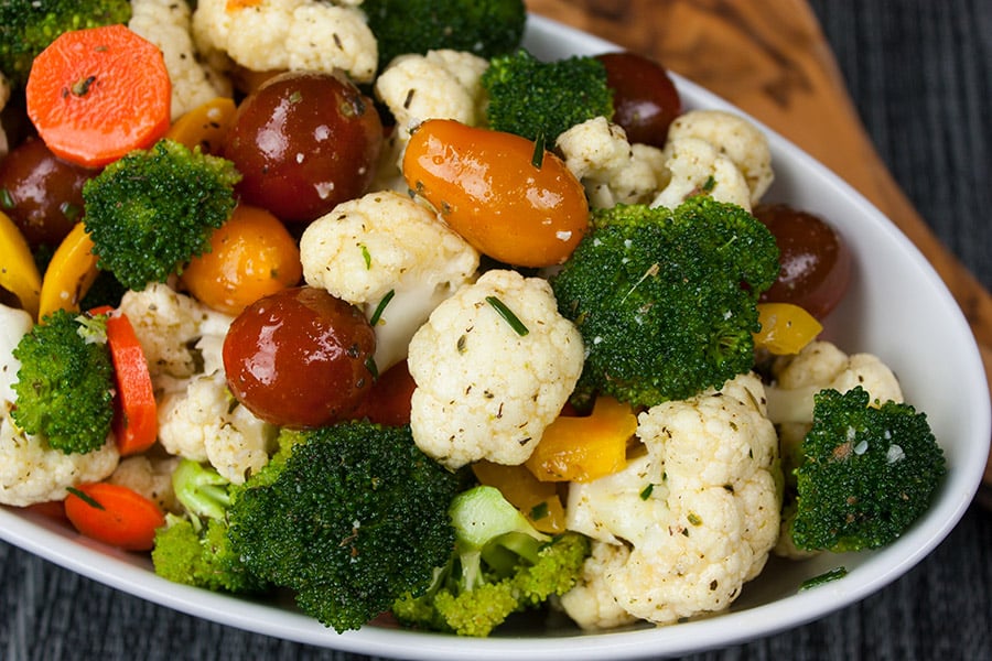 Healthy Marinated Fresh Vegetable Salad in a white serving bowl.