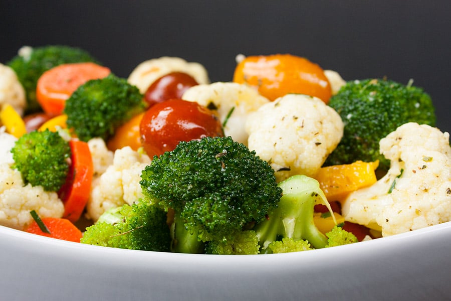 Marinated Fresh Vegetable Salad in a white serving bowl