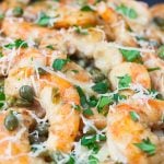 Fast & Easy Shrimp Piccata with cheese sprinkled on top.