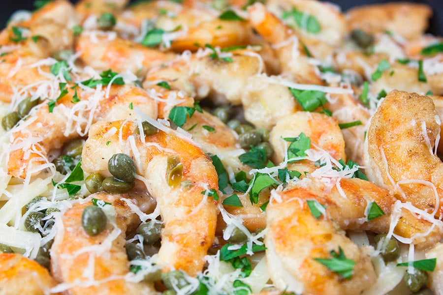 Fast & Easy Shrimp Piccata with cheese sprinkled on top.