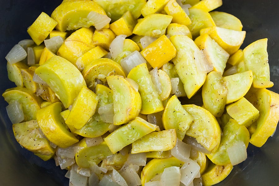 Southern Yellow Squash Casserole - sautéed yellow squash and onions in a glass mixing bowl