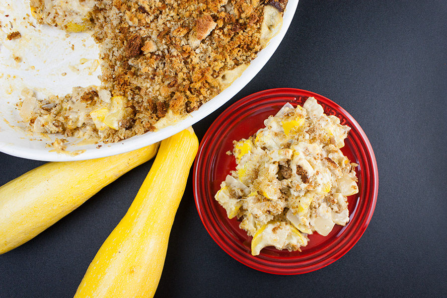 Southern Yellow Squash Casserole serving on a red plate