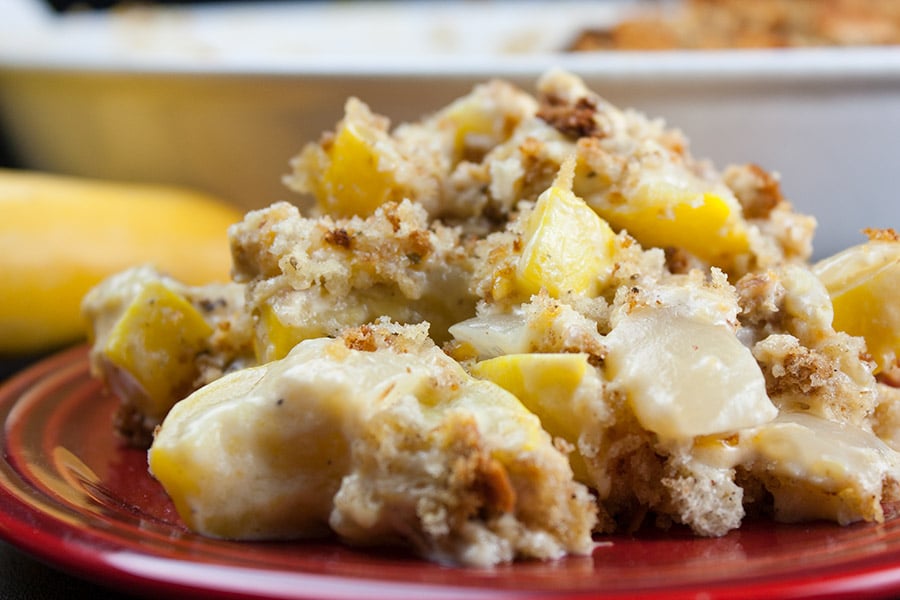 Southern Yellow Squash Casserole on a red plate.