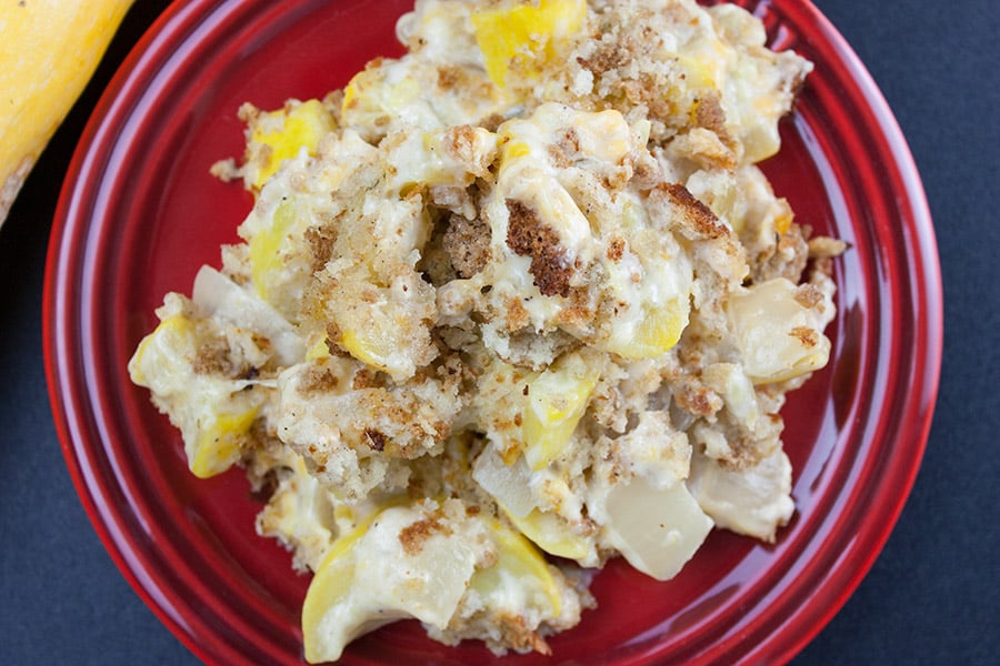 Southern Yellow Squash Casserole serving on a red plate