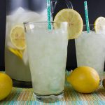 Honey Ginger Lemonade in tall glasses with lemon garnishes.