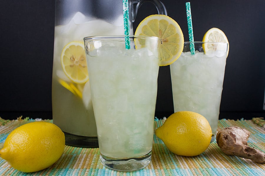Honey Ginger Lemonade in tall glasses with lemon garnishes.