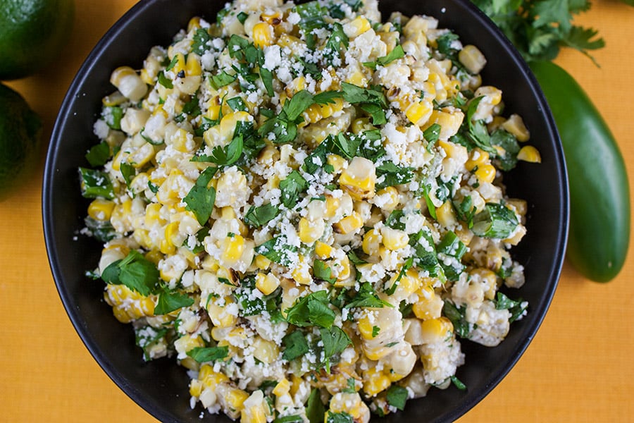 closeup of the Grilled Mexican Street Corn Salad in a black bowl