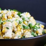 Grilled Mexican Street Corn Salad in a black bowl.