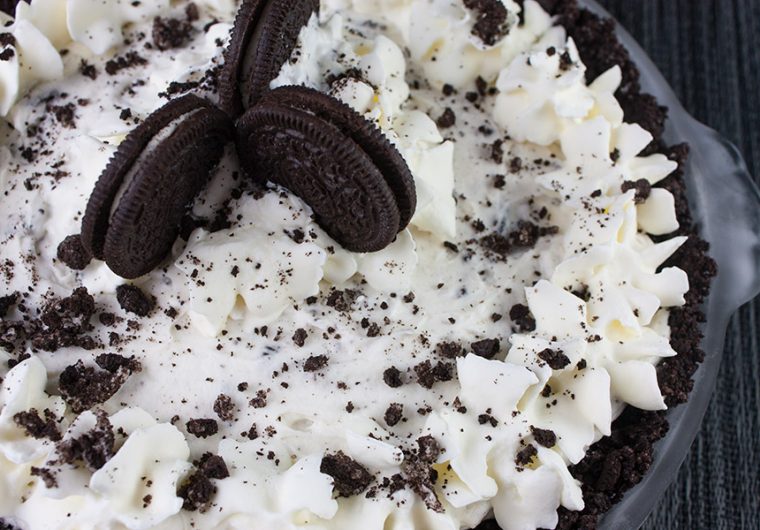 No Bake Cookies and Cream Pie - A delicious Oreo crust studded generously with everyone's favorite cookies and cream.
