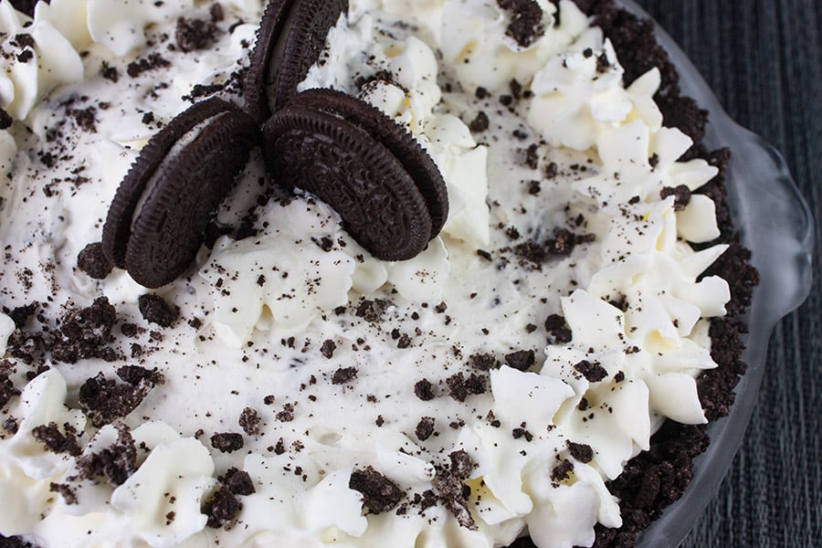 No Bake Cookies and Cream Pie - A delicious Oreo crust studded generously with everyone's favorite cookies and cream.