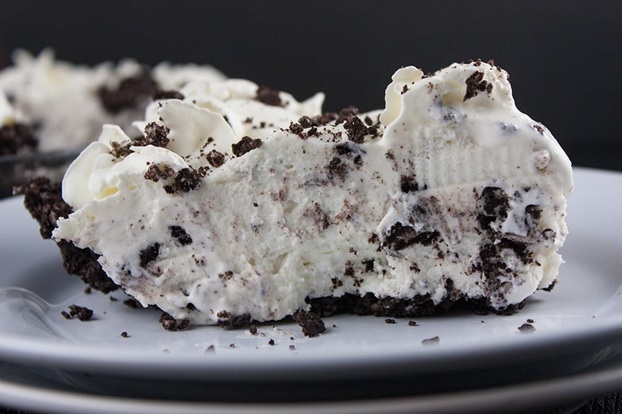 Cookies and Cream Pie - A delicious no bake Oreo cookie crust studded generously with everyone's favorite cookies and cream.