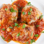 Easy Baked Parmesan Meatballs on a white platter.