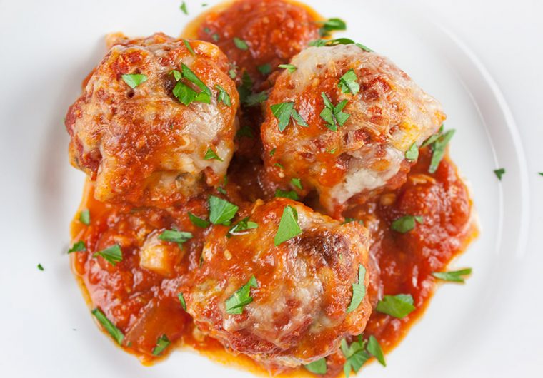 Easy Baked Parmesan Meatballs - One pan at it's best! Mouthwatering,tender, juicy, Italian meatballs smothered in goodness!