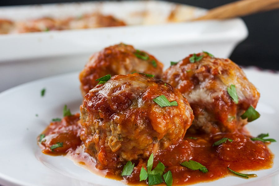 Easy Baked Parmesan Meatballs - One pan at it's best! Mouthwatering,tender, juicy, Italian meatballs smothered in goodness!