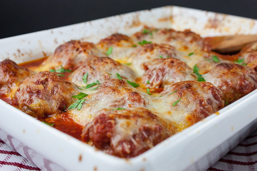 Easy Baked Parmesan Meatballs - One pan at it's best! Mouthwatering,tender, juicy, Italian meatballs smothered in goodness!