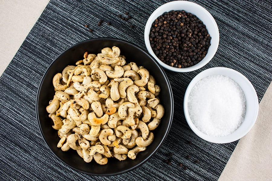 Roasted cashews in a black bowl