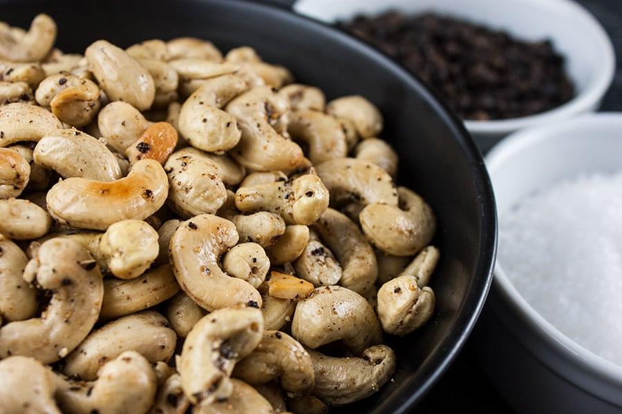 Salt and Pepper Roasted Cashews - Tantalize your taste buds with these spicy roasted cashews! So simple you will kick yourself for not trying this recipe sooner.
