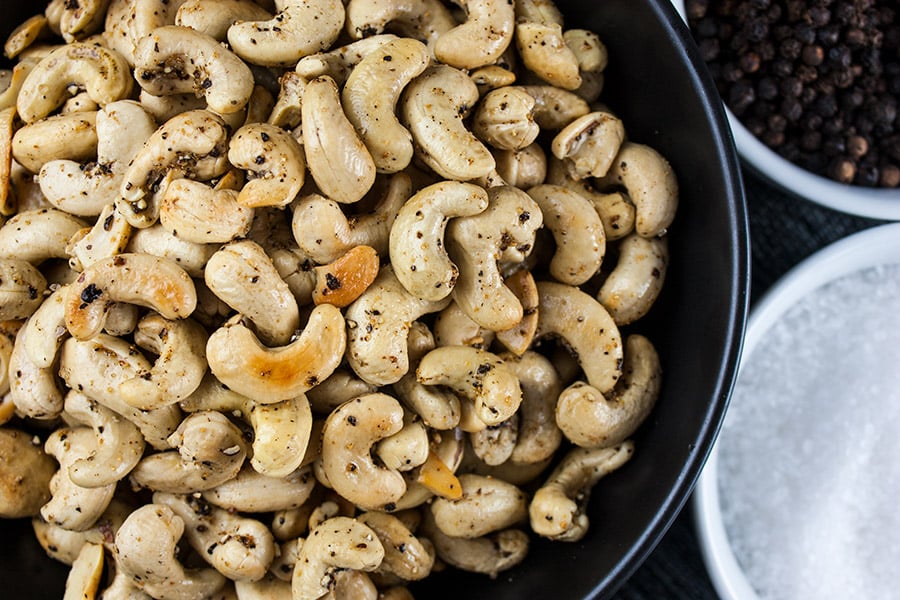 Salt and Pepper Roasted Cashews - Tantalize your taste buds with these savory spice kissed roasted cashews! So simple you will kick yourself for not trying this recipe sooner.