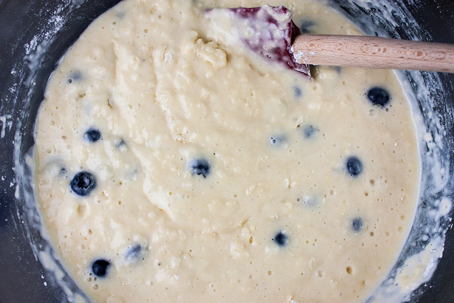Lemon Streusel Blueberry Muffins batter mixed in a glass bowl
