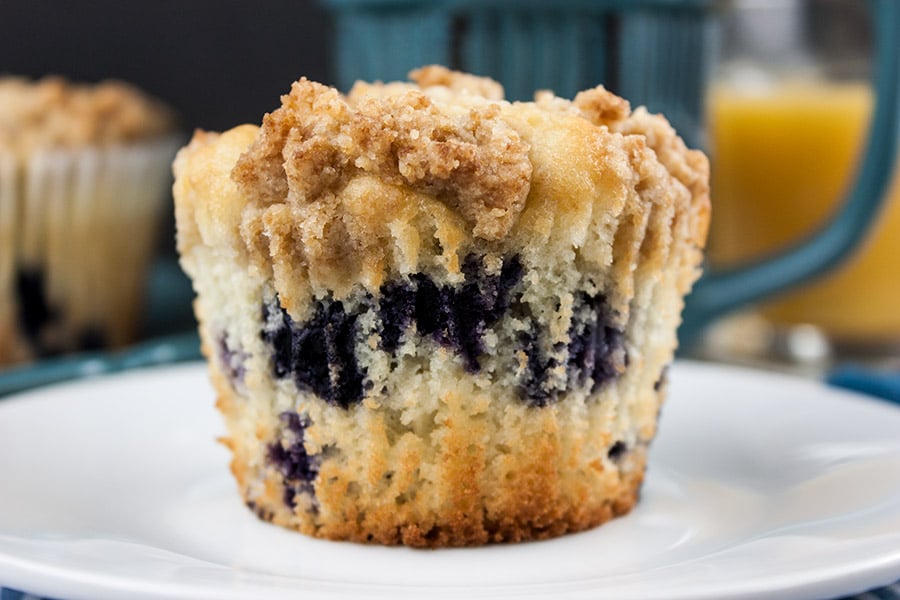 Lemon Streusel Blueberry Muffin on a white plate.