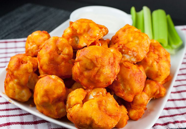 Baked Buffalo Cauliflower Bites - Crispy on the outside and just tender enough on the inside. The vegetarian buffalo wing!
