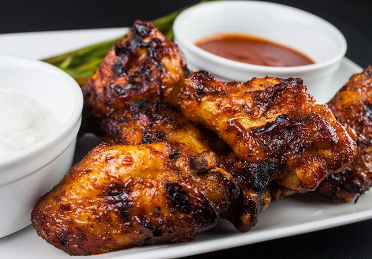 Cajun Smoked Wings - These barbecued wings have a spicy Cajun rub meeting up with some sweet Pecan wood smoke, then finished off with an aromatic hot sauce. They are deliciously smokey and spicy with a slight sticky sweet sauce that brings it all together in the most incredible wing you will ever have.
