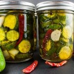 Spicy Bread and Butter Pickles in mason jars.