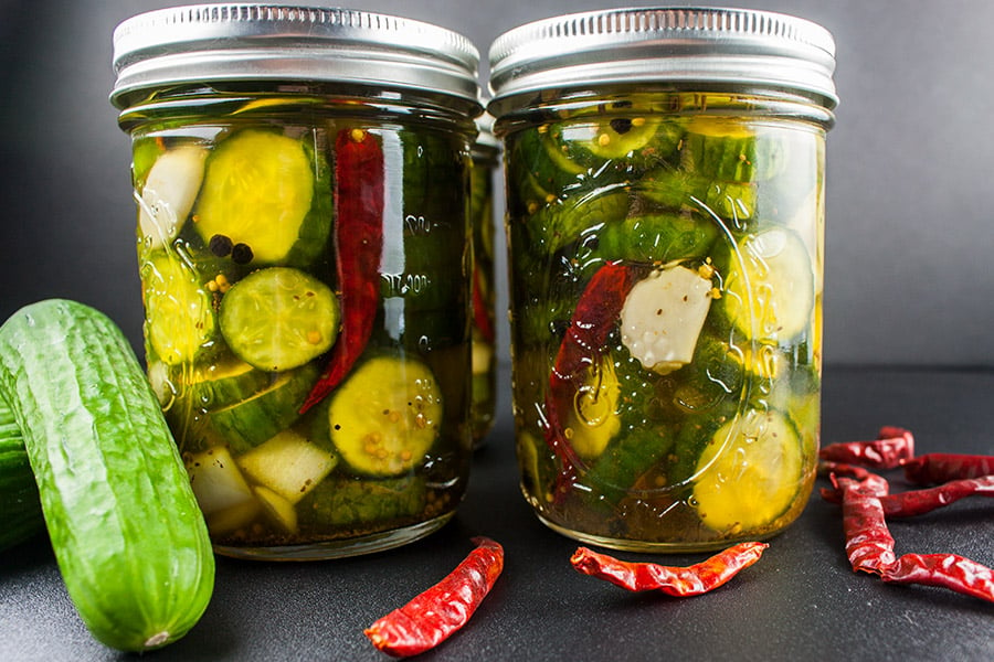 Spicy Bread and Butter Pickles in mason jars.