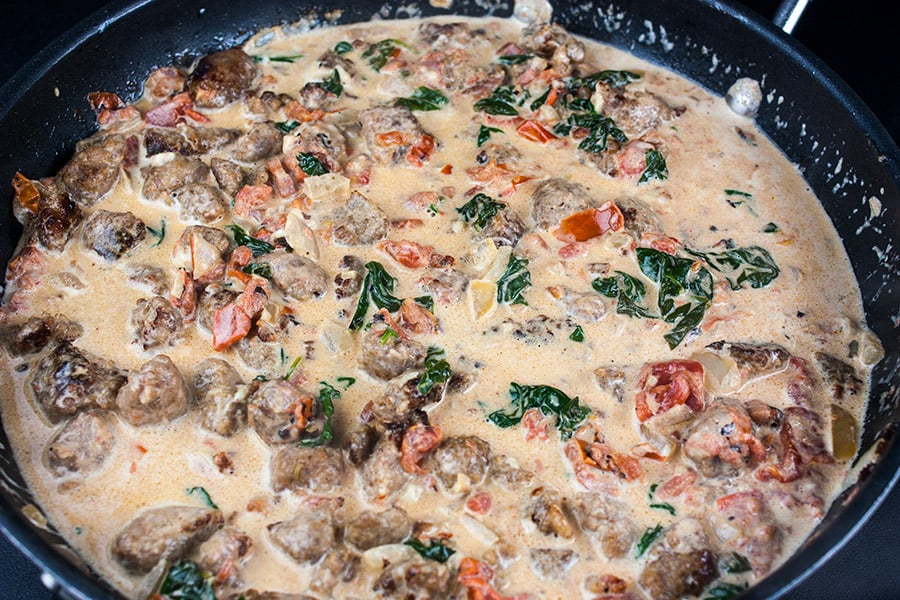 Italian Sausage Rigatoni with Spicy Tomato Cream Sauce - cream sauce in a large skillet