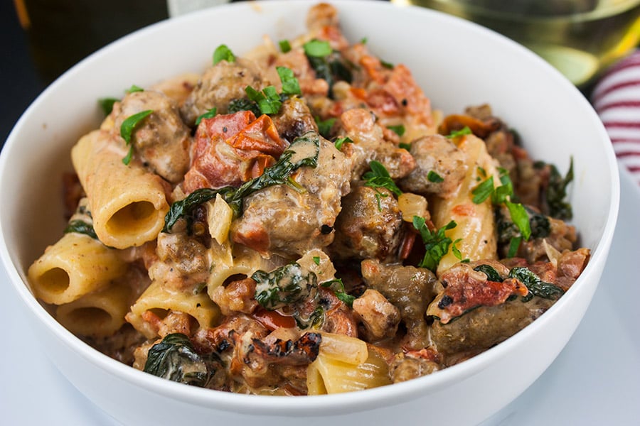 Italian Sausage Rigatoni with Spicy Tomato Cream Sauce - in a white bowl