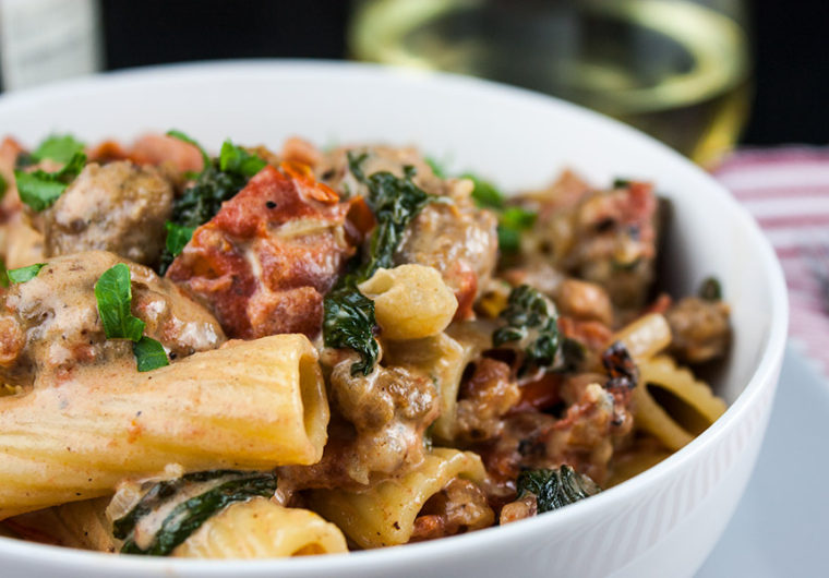 Italian sausage rigatoni in a white bowl