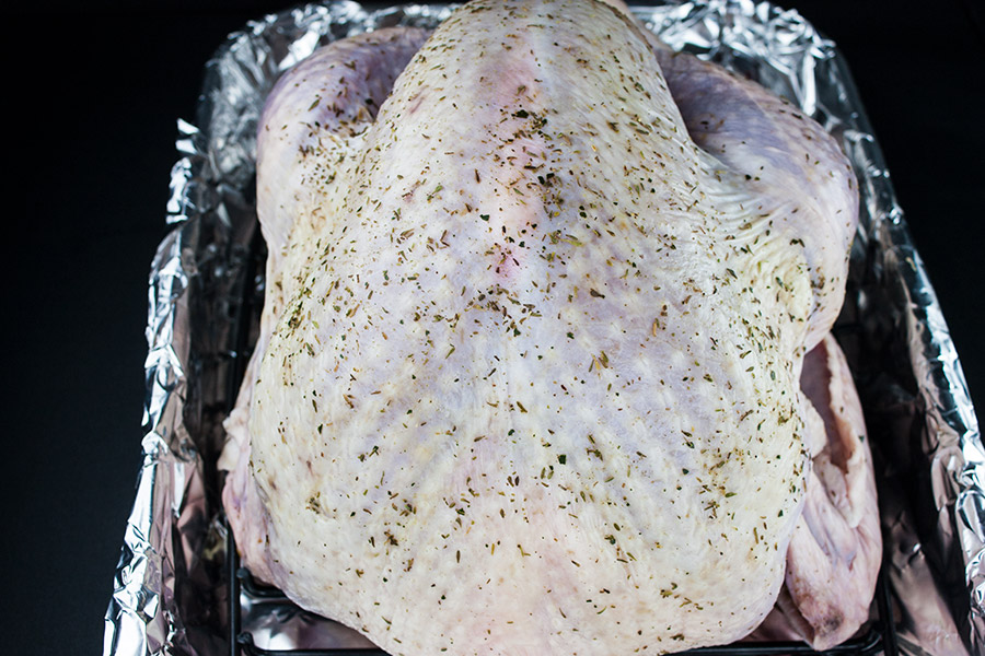Simple Succulent Roast Turkey (Dry Brine) - turkey in a foil lined roasting pan