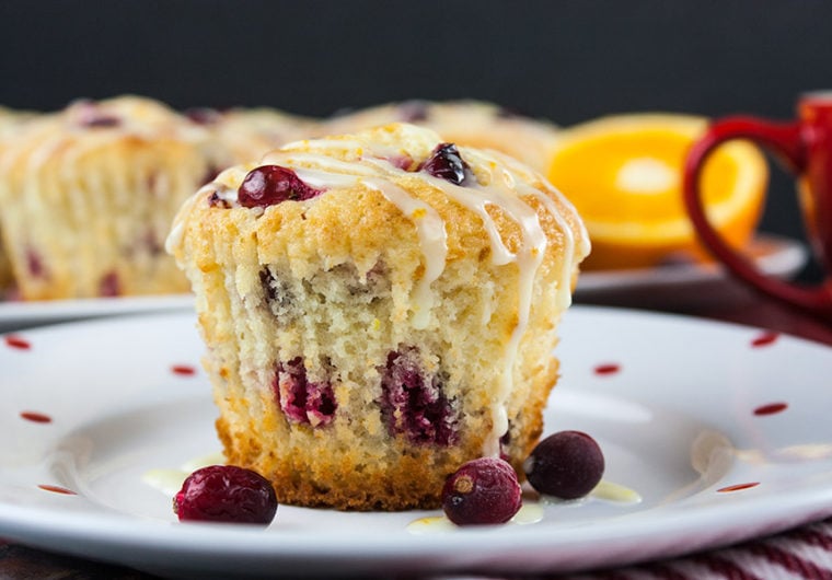 Cranberry Orange Muffins - Simply the best. A sweet buttery muffin filled with tart, juicy cranberries, orange zest, and an orange glaze.