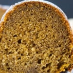 A close up of a slice of pumpkin spice bundt cake on a white plate.