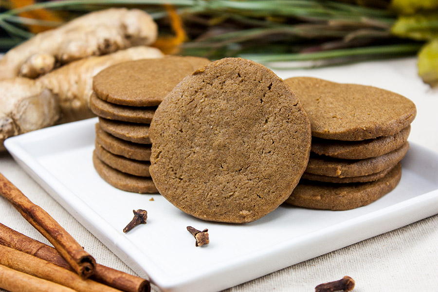 Crispy Gingersnap Cookies - stacked on a white plate