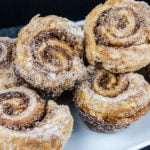 Puff pastry morning buns on a white plate.