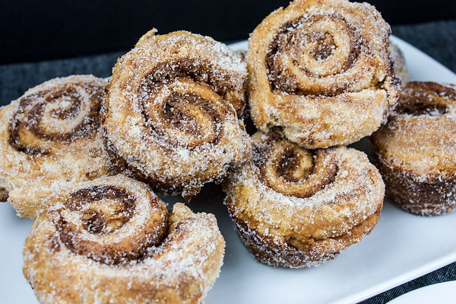 Puff pastry morning buns on a white plate.