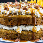 Easy Pumpkin Cake with Cream Cheese Filling on a cake serving plate.