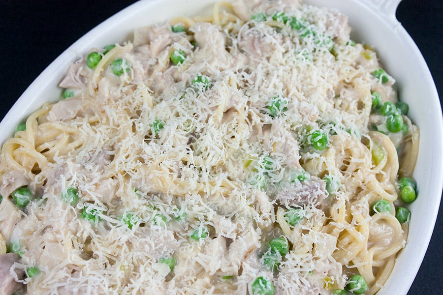 Unbaked turkey tetrazzini in a white casserole dish.