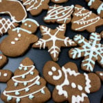 Decorated gingerbread cookies on a slate.