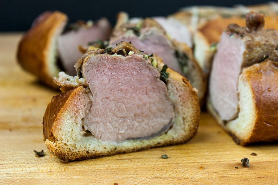 Tucan Pork Tenderloin sliced on a wooden cutting board