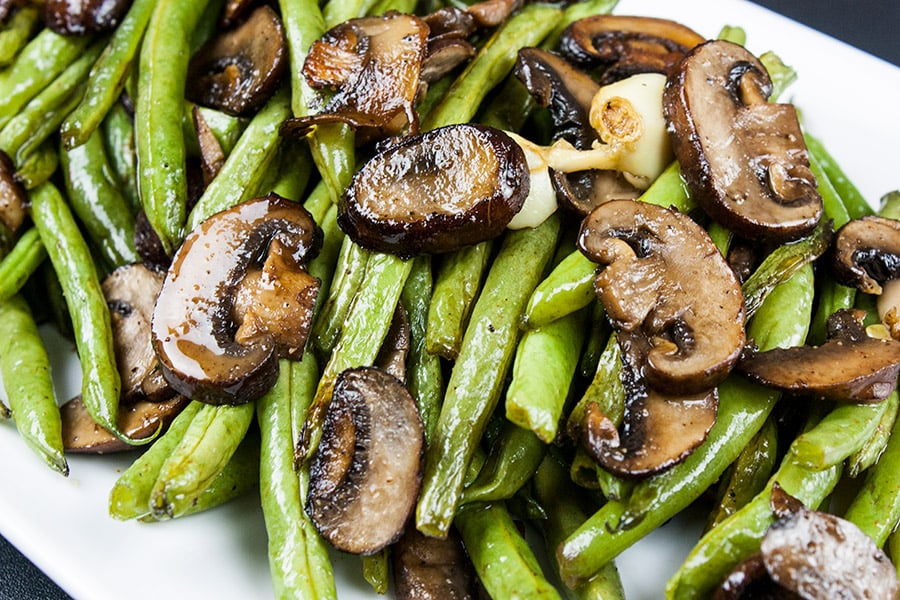 Roasted Green Beans and Mushrooms - Fresh green beans and crimini mushrooms tossed with garlic-infused oil and roasted for a tasty twist.