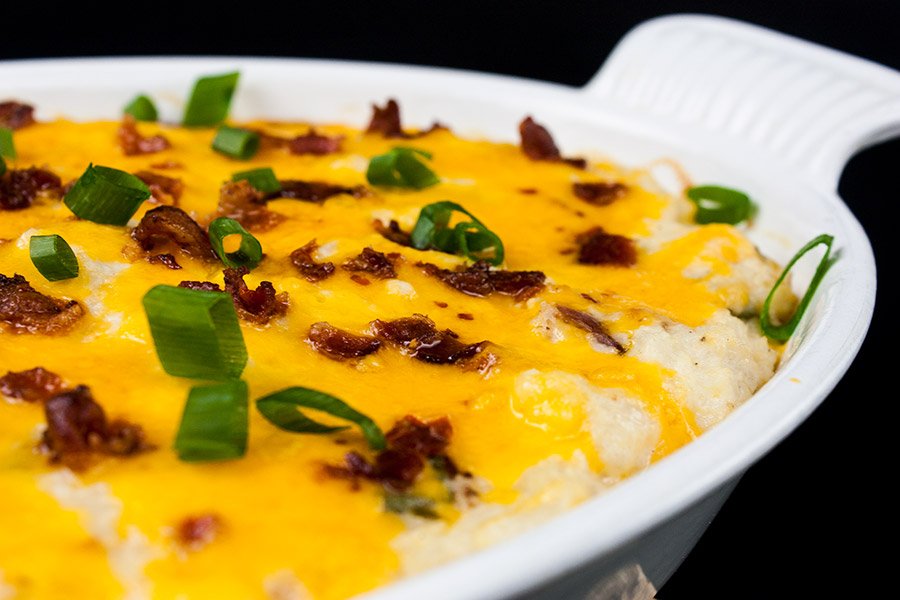 Loaded Cauliflower Mash Casserole - Perfect swap out for twice baked potatoes. It's unbelievably tasty and full of the loaded baked potato flavors you crave!