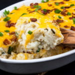 Loaded Cauliflower Mash Casserole - Perfect swap out for twice baked potatoes. It's unbelievably tasty and full of the loaded baked potato flavors you crave!