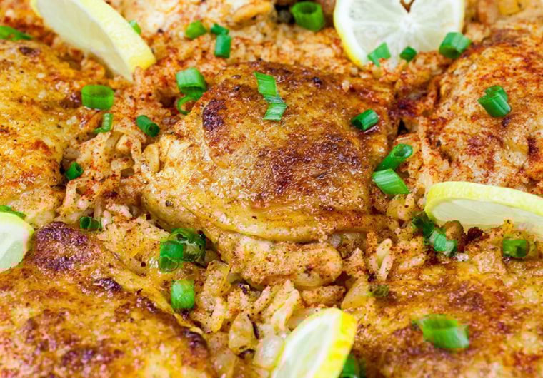 One Pan Spanish Chicken and Rice - Crispy zesty chicken nestled in bold mouthwatering, flavorful rice. A fabulous one-pan-meal.