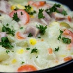 Easy Ham and Potato Soup in a dark bowl.