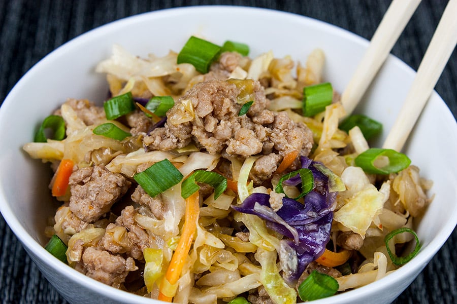 Pork Egg Roll Bowl in a white bowl with chopsitcks.