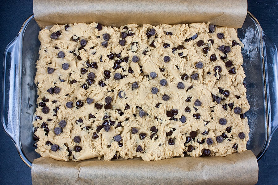 The dough pressed into a parchment lined baking pan.