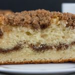 Cinnamon Crumb Coffee Cake on a white plate.